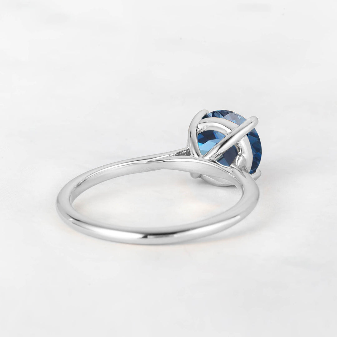 Pretti Round Blue Topaz Engagement Ring