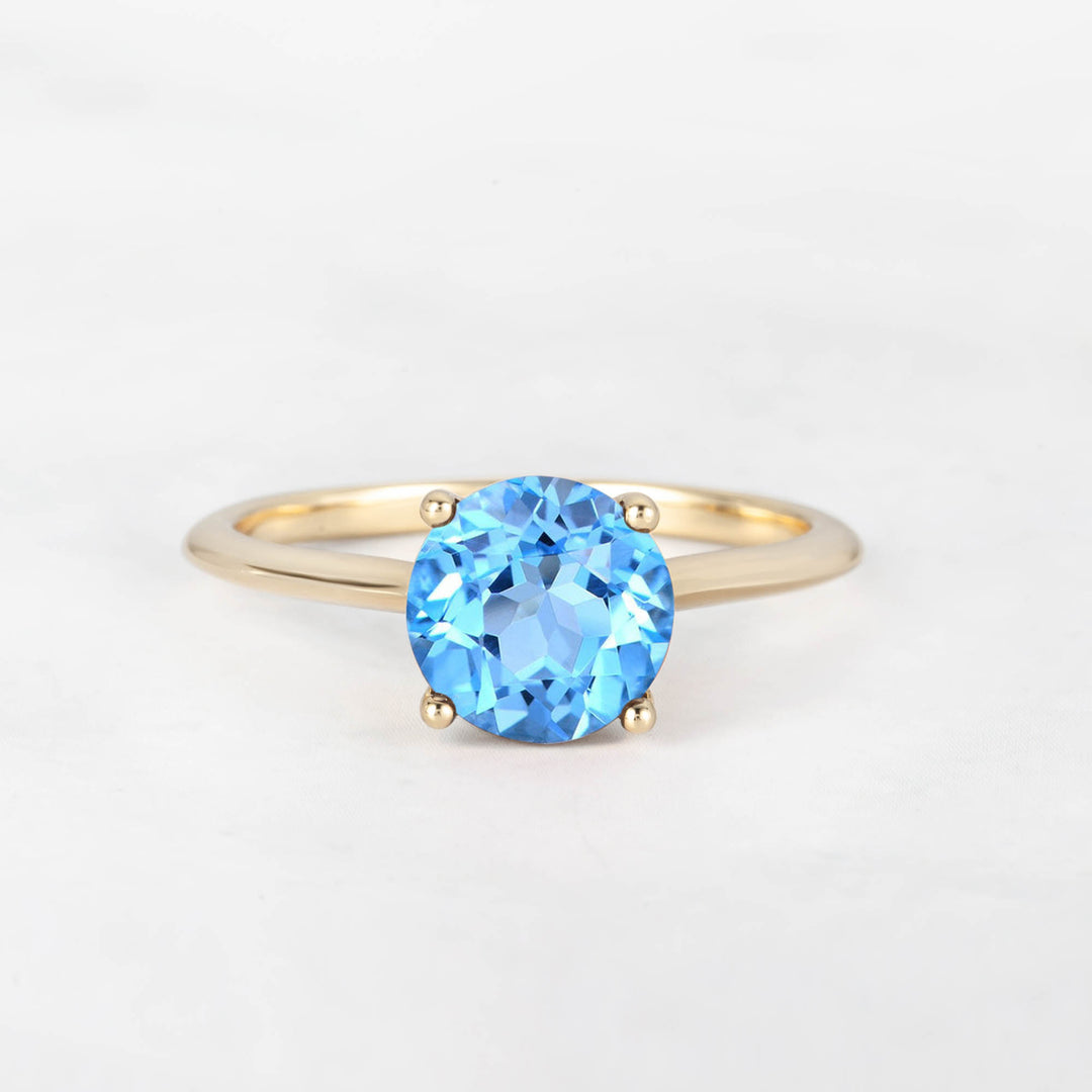 Pretti Round Sky Blue Topaz Engagement Ring