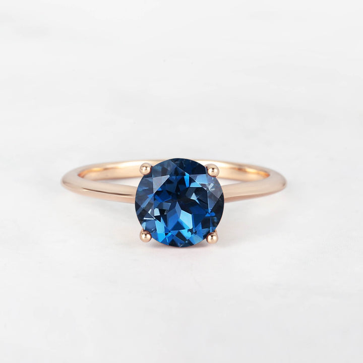 Pretti Round Blue Topaz Engagement Ring