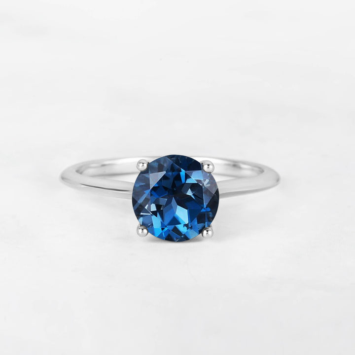 Pretti Round Blue Topaz Engagement Ring