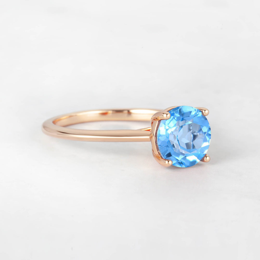 Pretti Round Sky Blue Topaz Engagement Ring