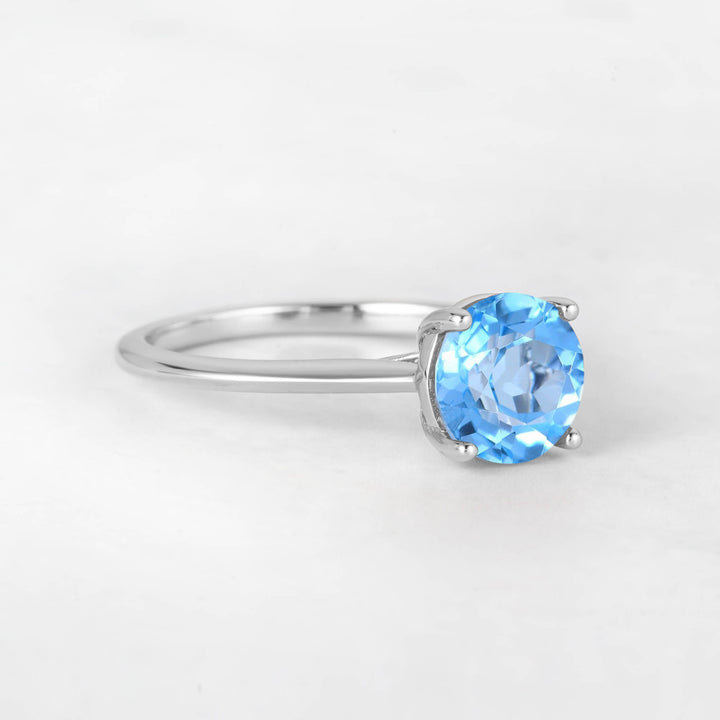 Pretti Round Sky Blue Topaz Engagement Ring