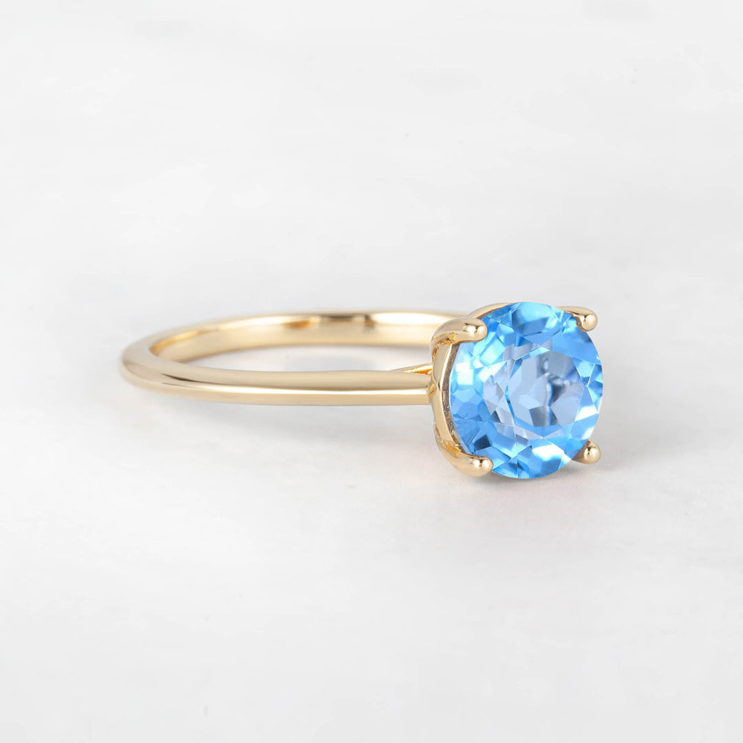 Pretti Round Sky Blue Topaz Engagement Ring