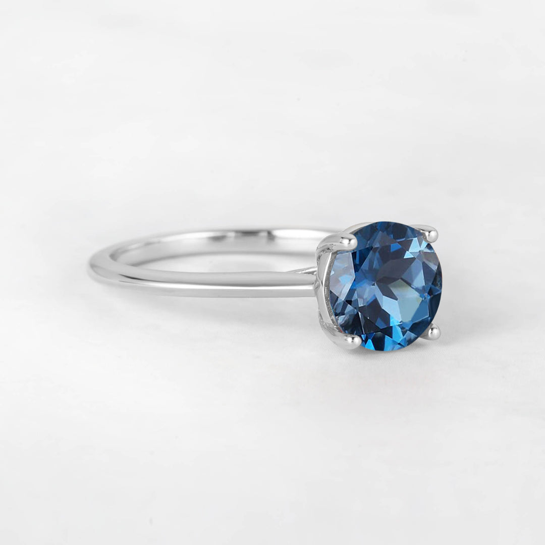 Pretti Round Blue Topaz Engagement Ring